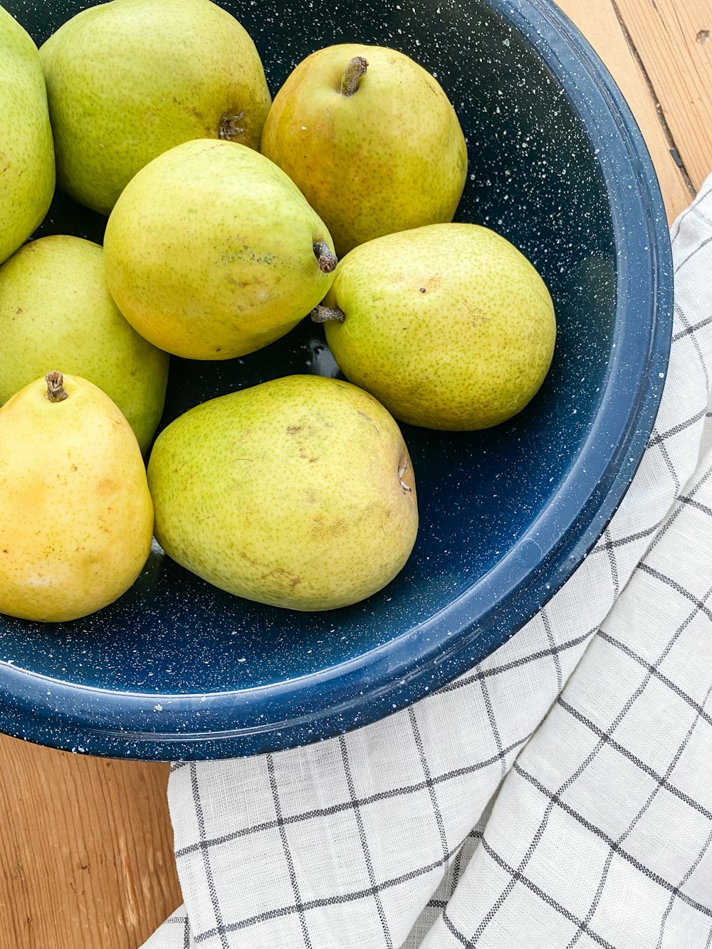 yellow fruit on blue plastic container