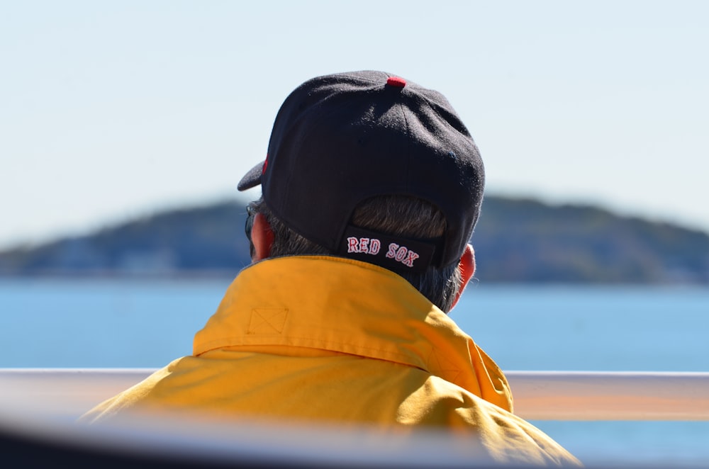 man in yellow jacket and black knit cap