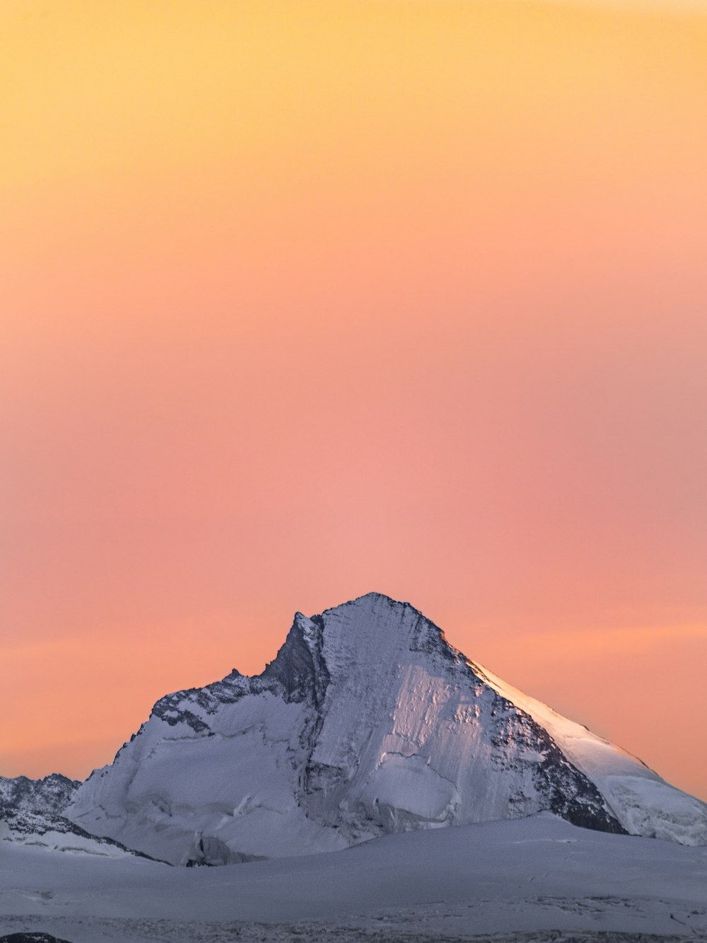 snow covered mountain under blue sky during daytime