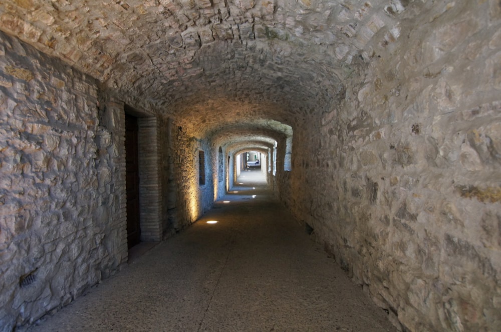 a long tunnel with a light at the end