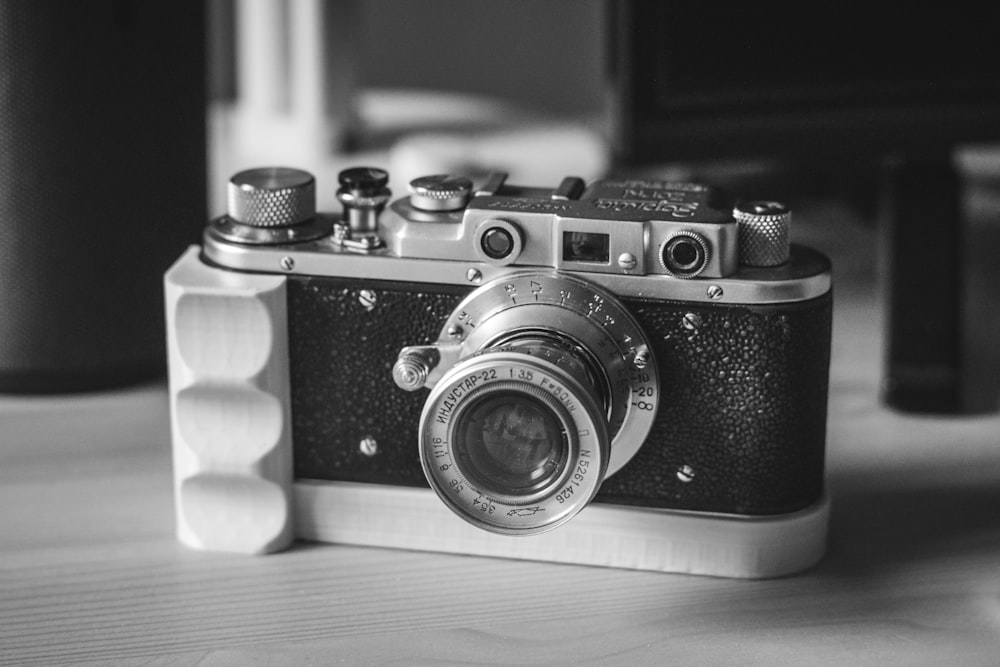 black and silver camera on table