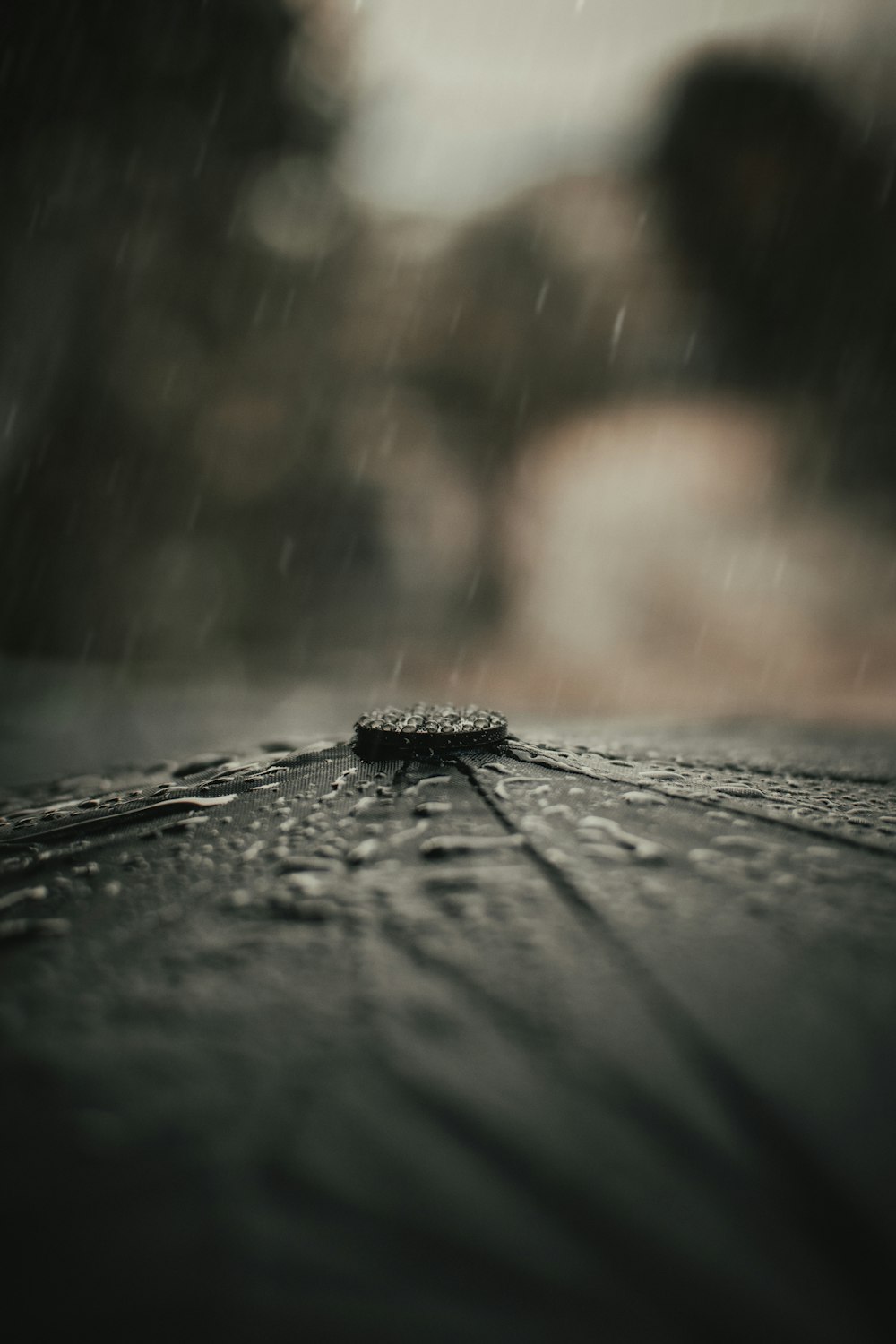 water droplets on brown wooden surface