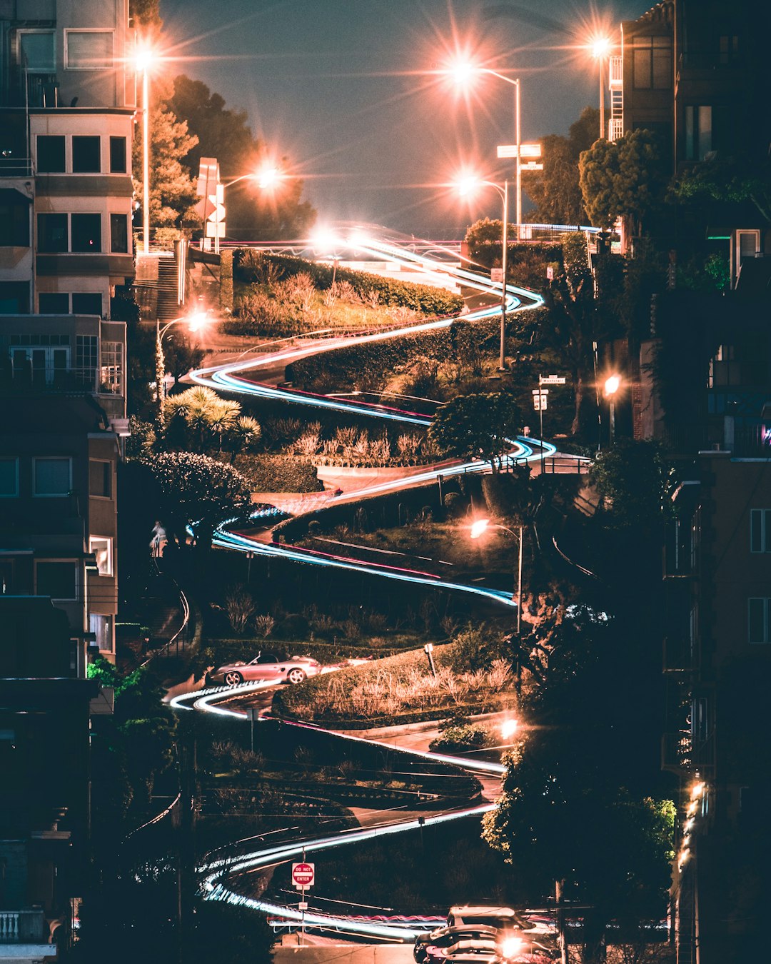 white and brown building near body of water during night time