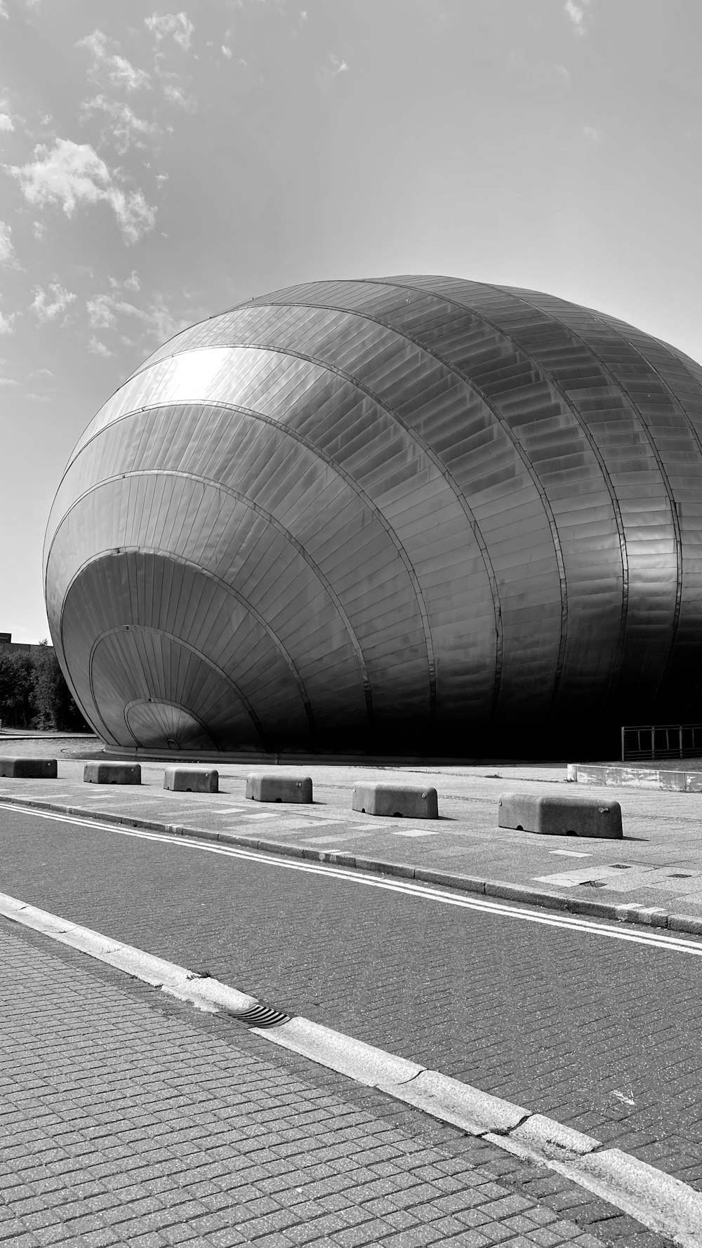 grayscale photo of round tunnel