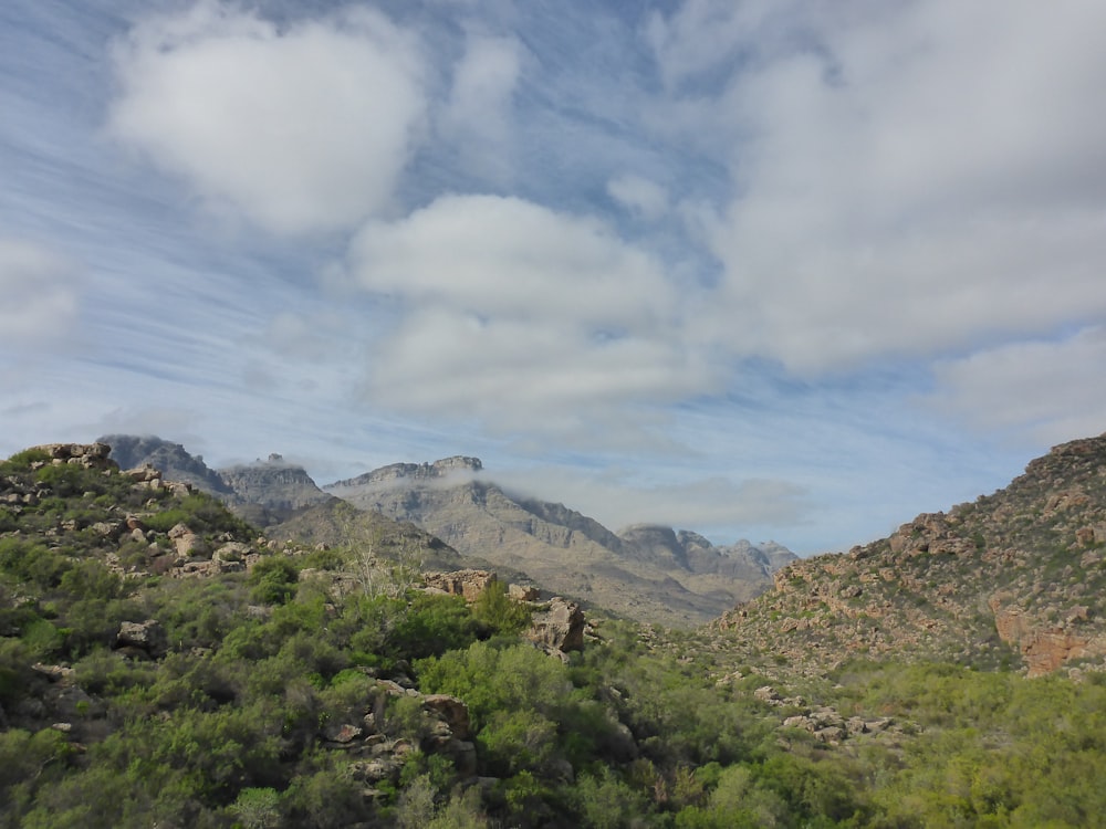 a view of a mountain range from a moving vehicle