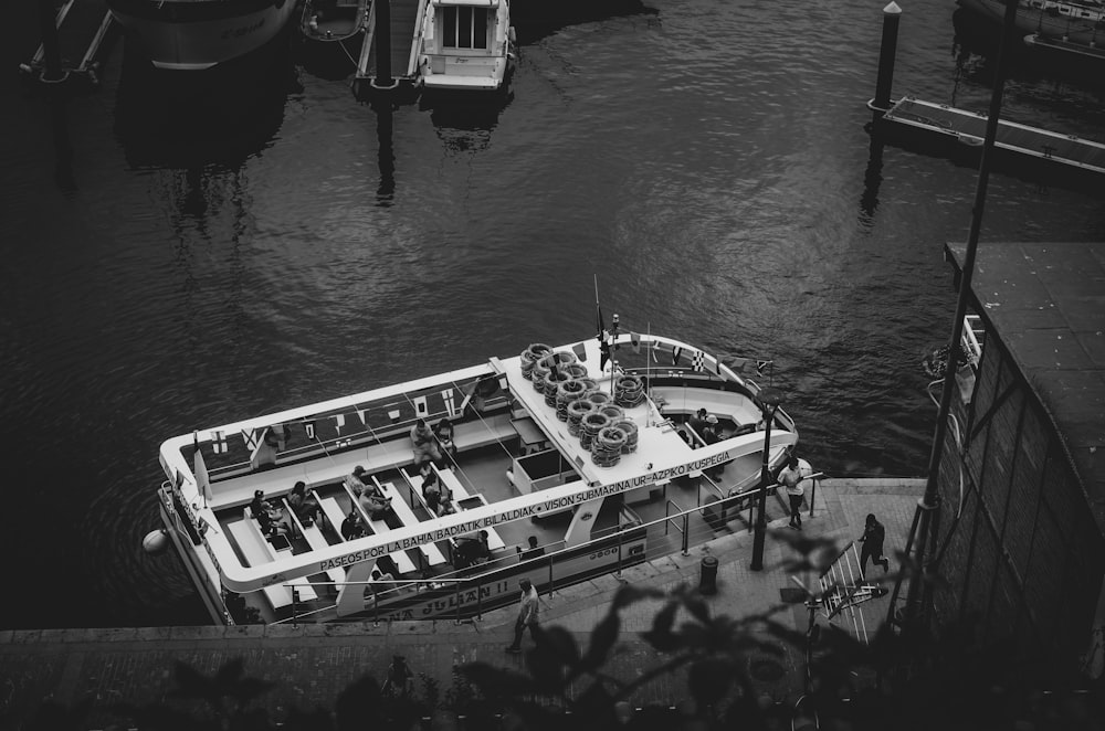 grayscale photo of boat on water