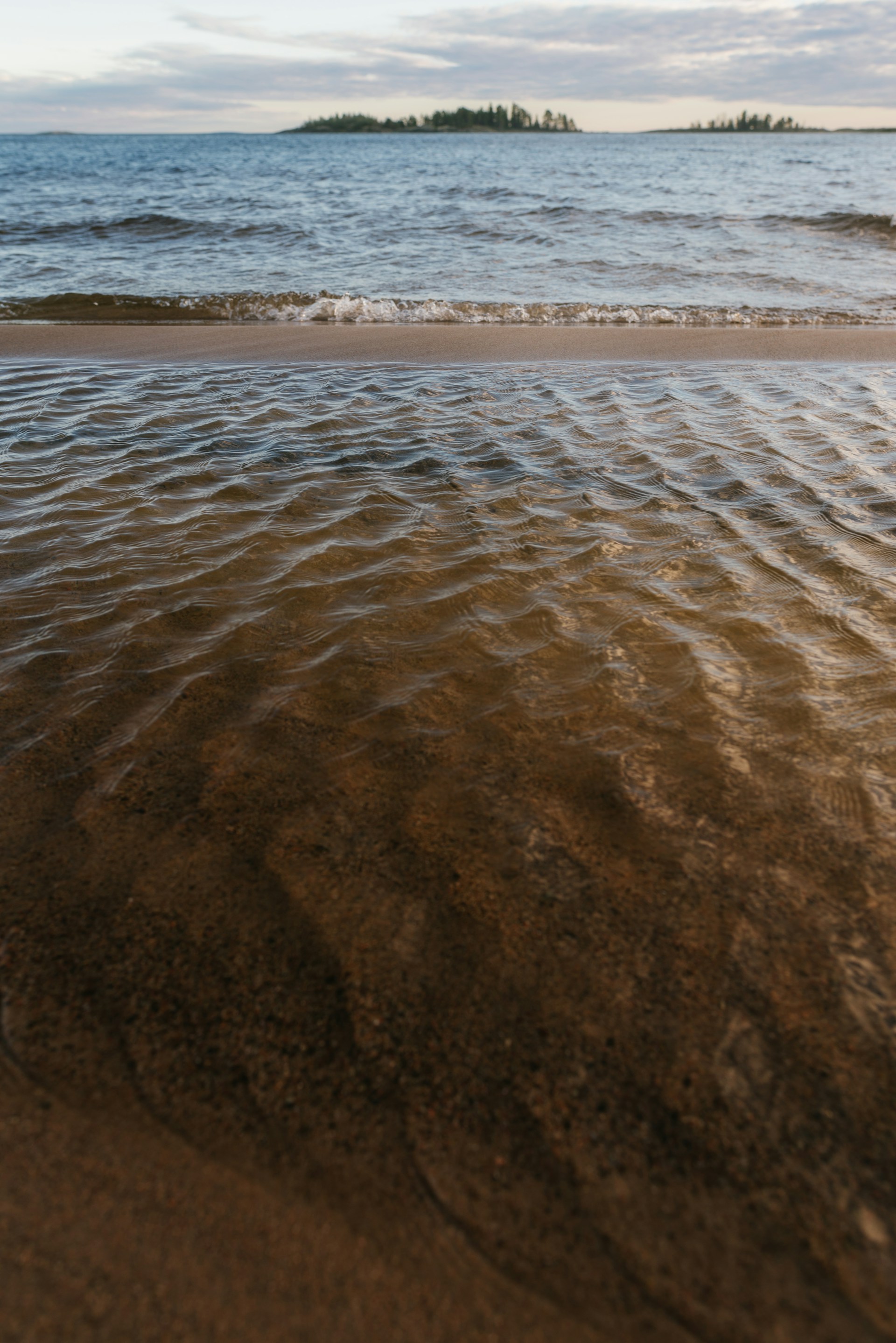 woman wearing yellow long-sleeved dress under white clouds and blue sky during daytime