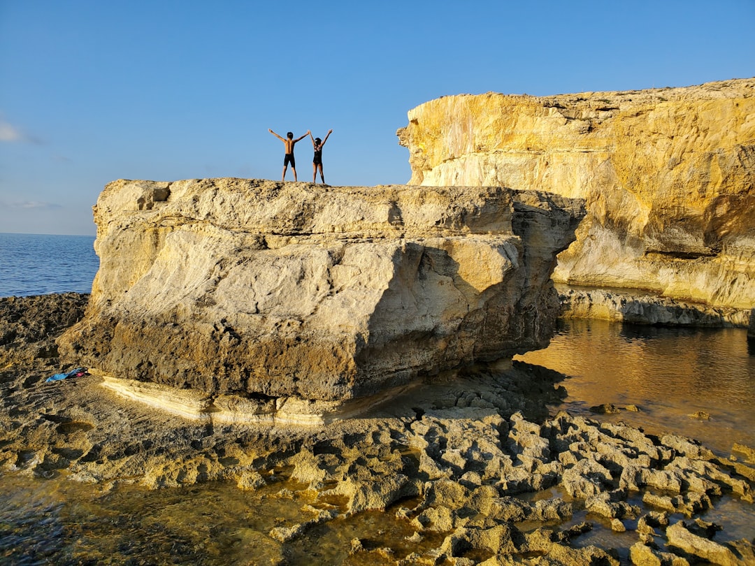 Coastal and oceanic landforms photo spot Malta Għajn Tuffieħa