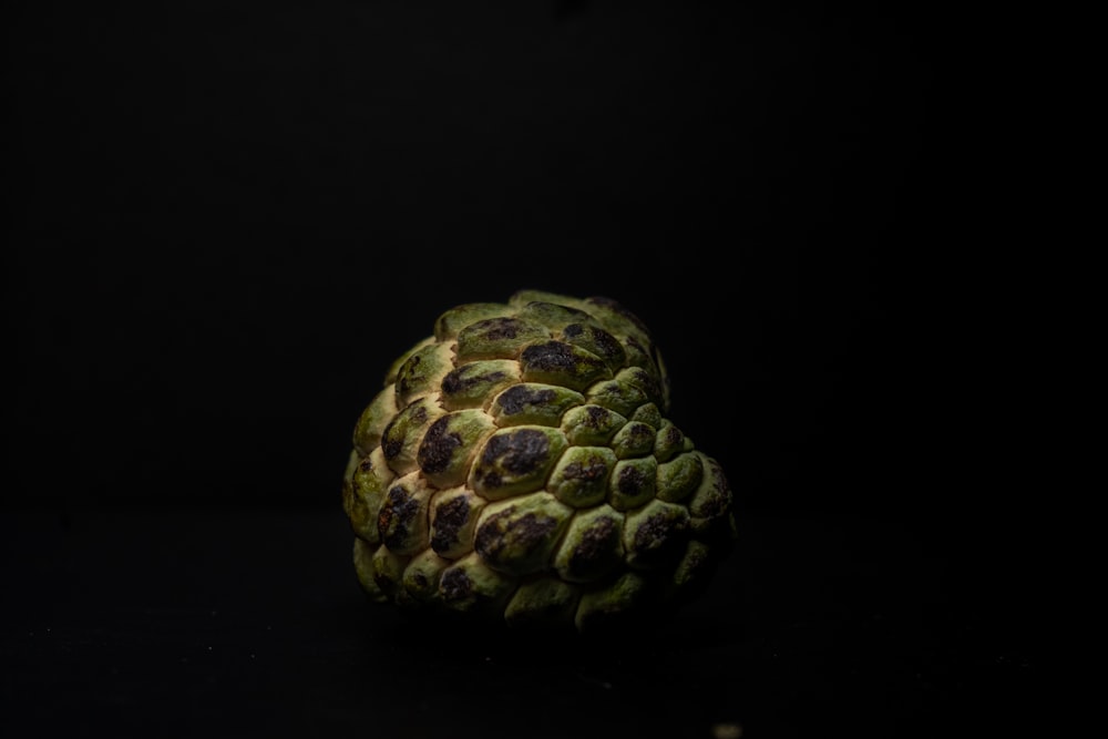 green and black round fruit