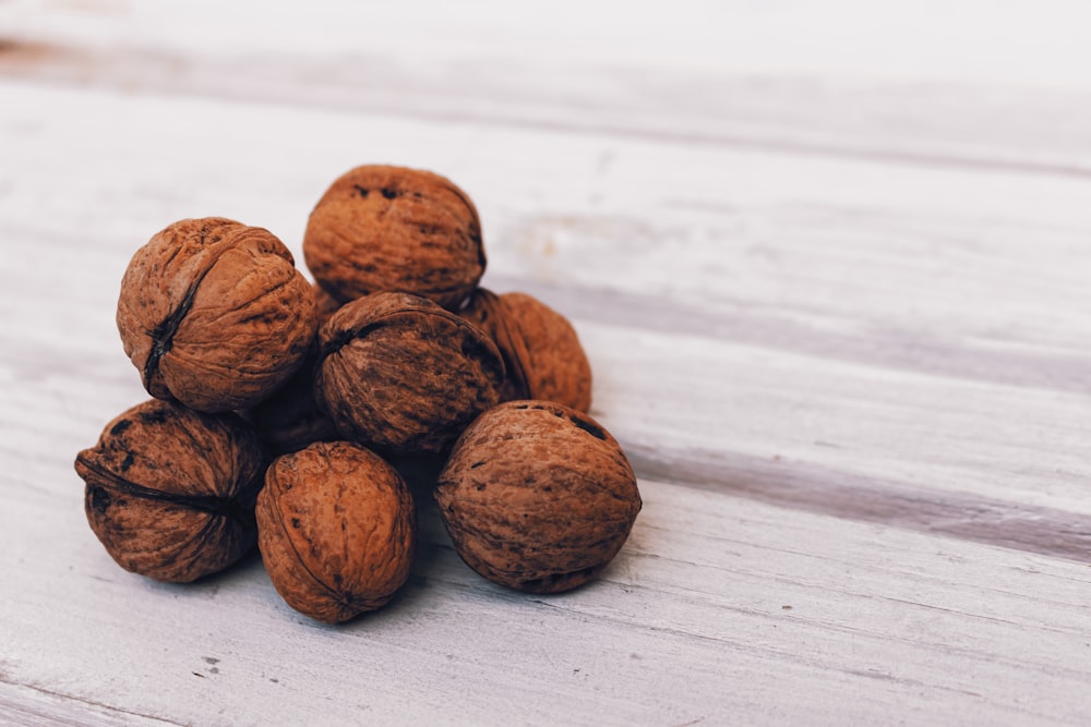 brown round nut on white wooden table