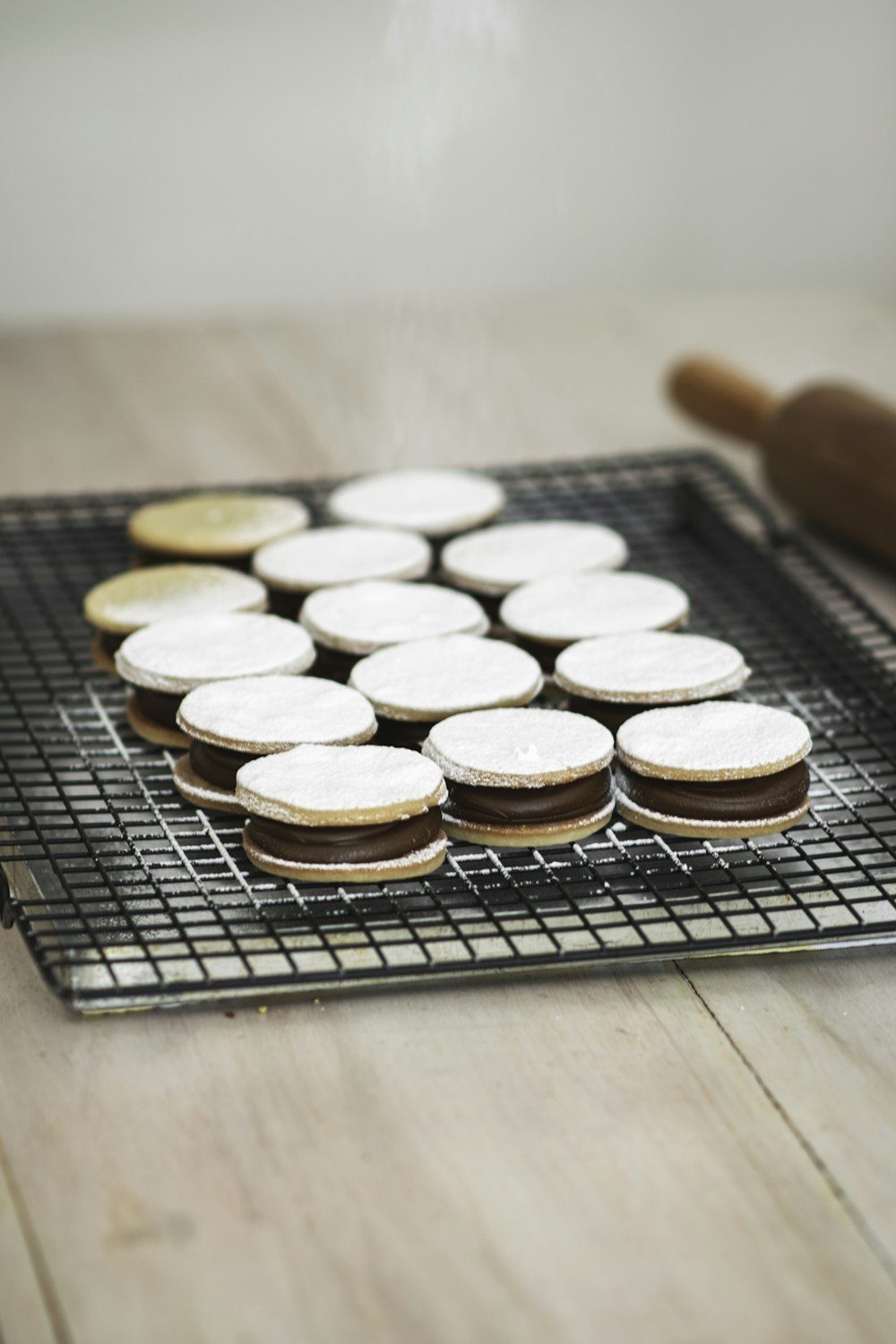 white and brown round coins on black metal tray