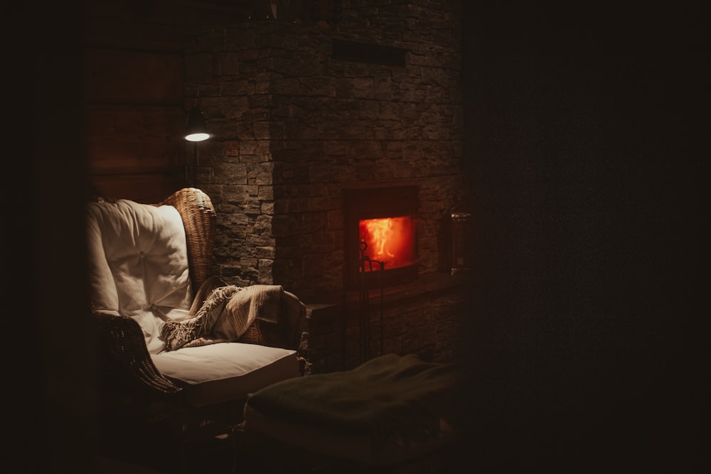 man in white long sleeve shirt sitting on white bed