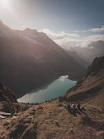 A group of friends enjoying a scenic picnic beside a crystal-clear lake in the northern valleys.