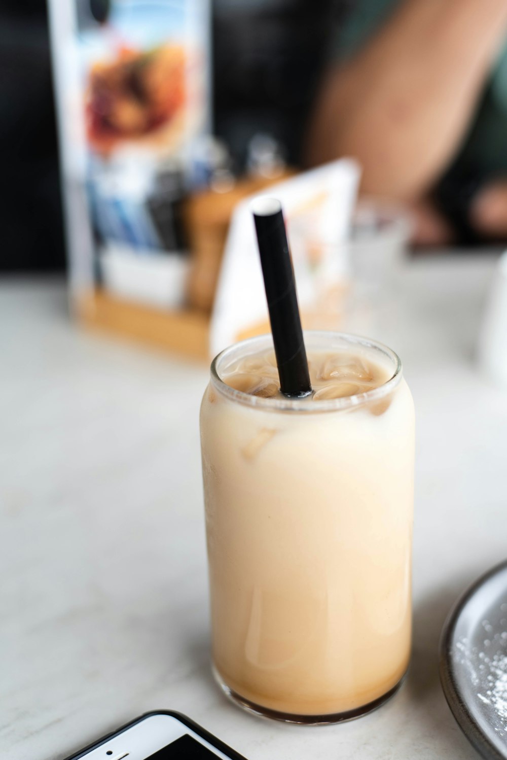 clear drinking glass with white liquid