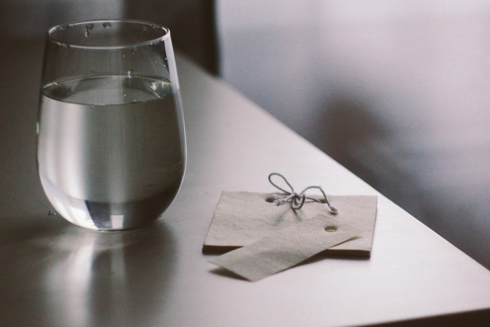 clear drinking glass on white tissue paper