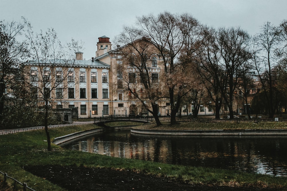 brown concrete building near body of water during daytime