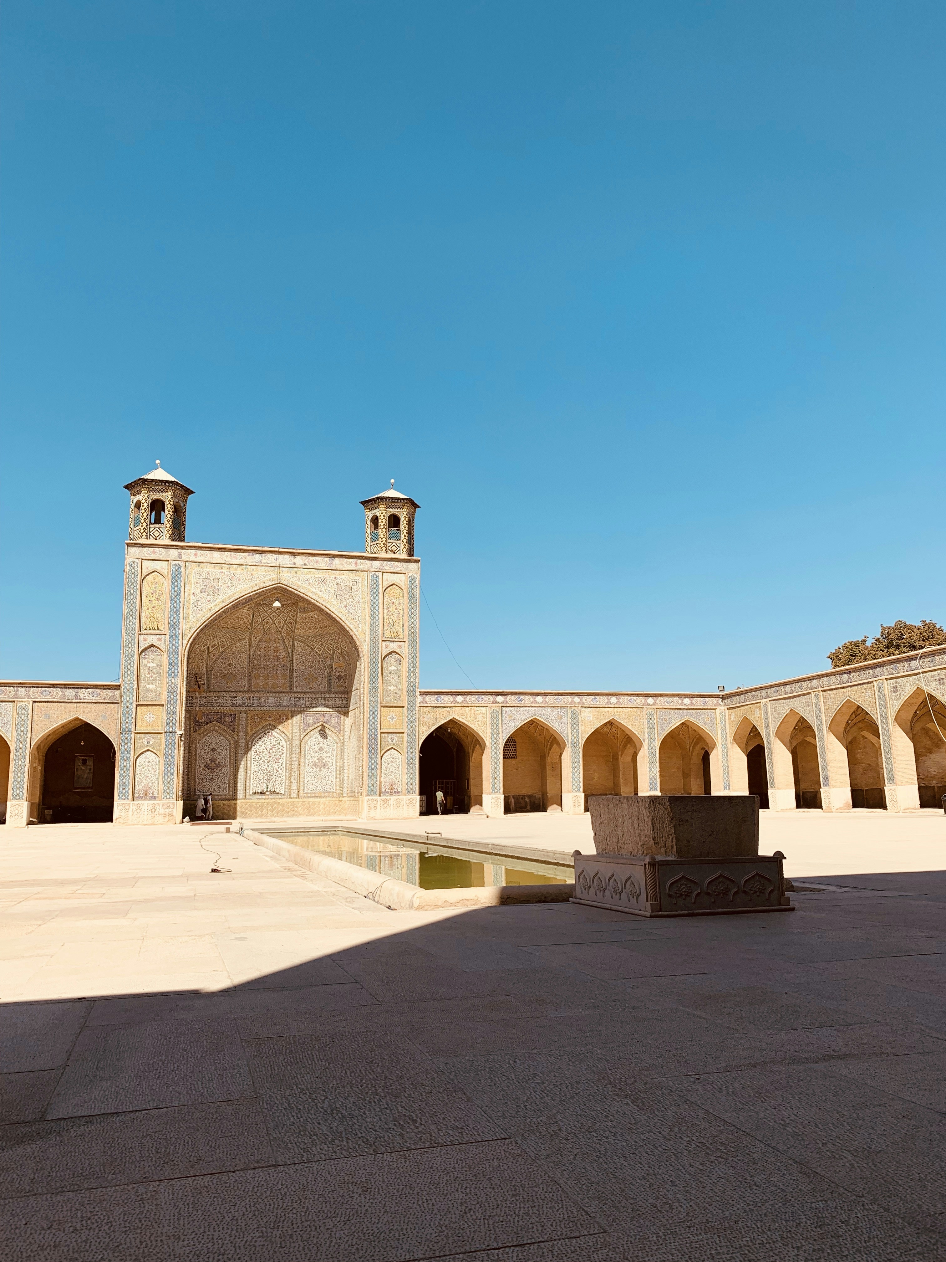 beige concrete building under blue sky during daytime