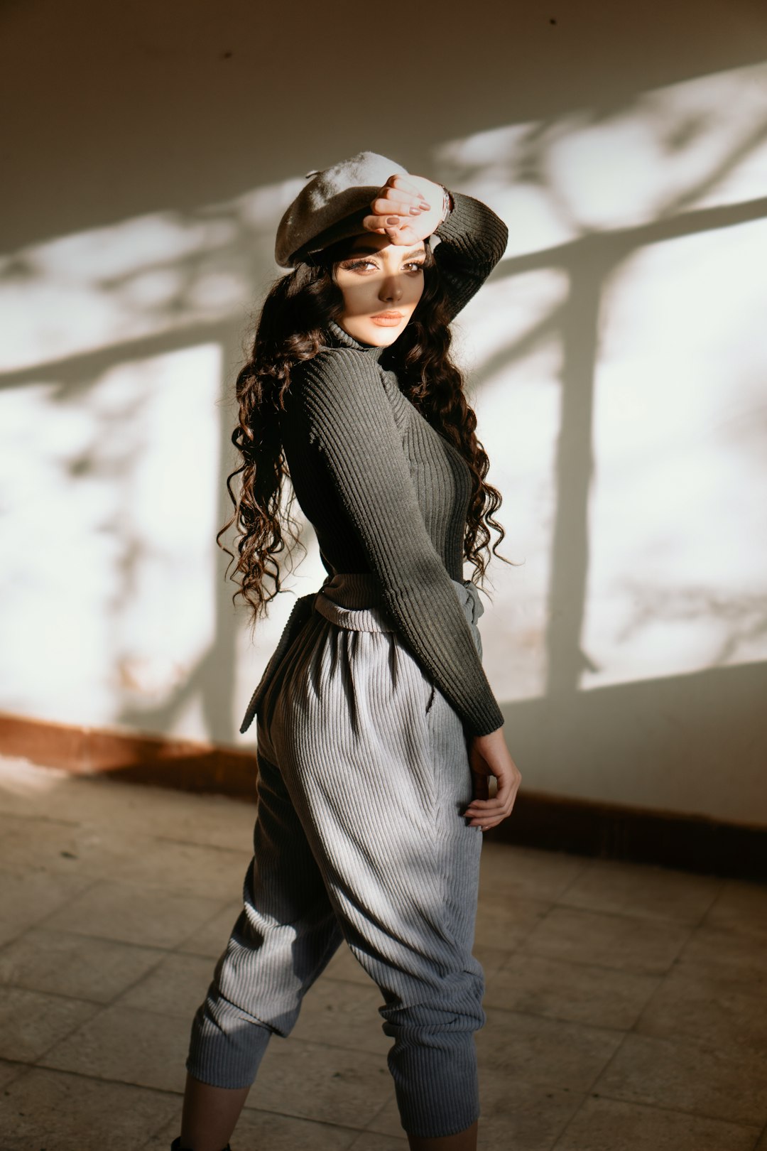 woman in black and white striped long sleeve shirt and blue skirt