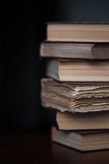stack of books on black background