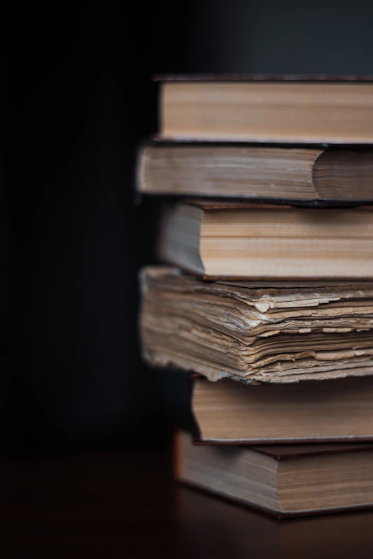 stack of books on black background