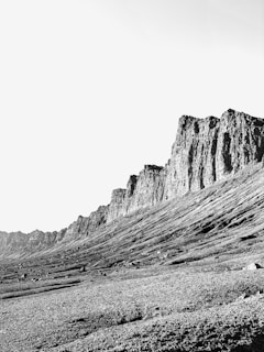 grayscale photo of rocky mountain