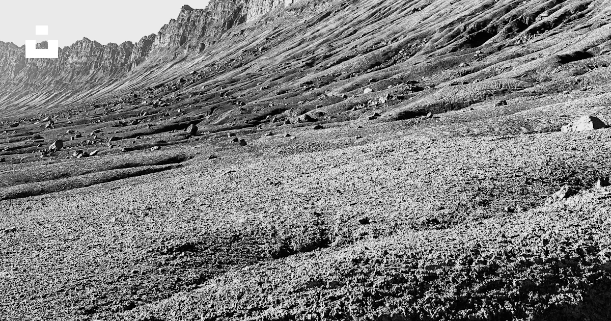 Grayscale photo of rocky mountain photo – Free Ravar Image on Unsplash