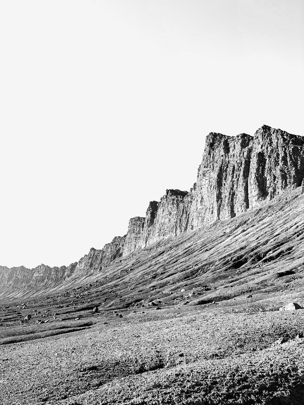 grayscale photo of rocky mountain