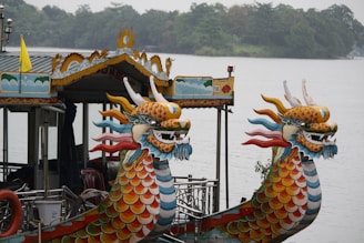 Ha Long Bay's Limestone Karsts yellow and blue dragon on brown wooden boat