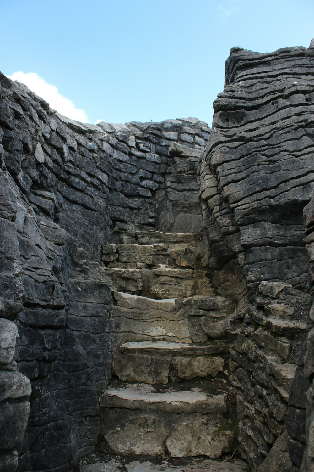 a set of stone steps leading up to the top of a mountain