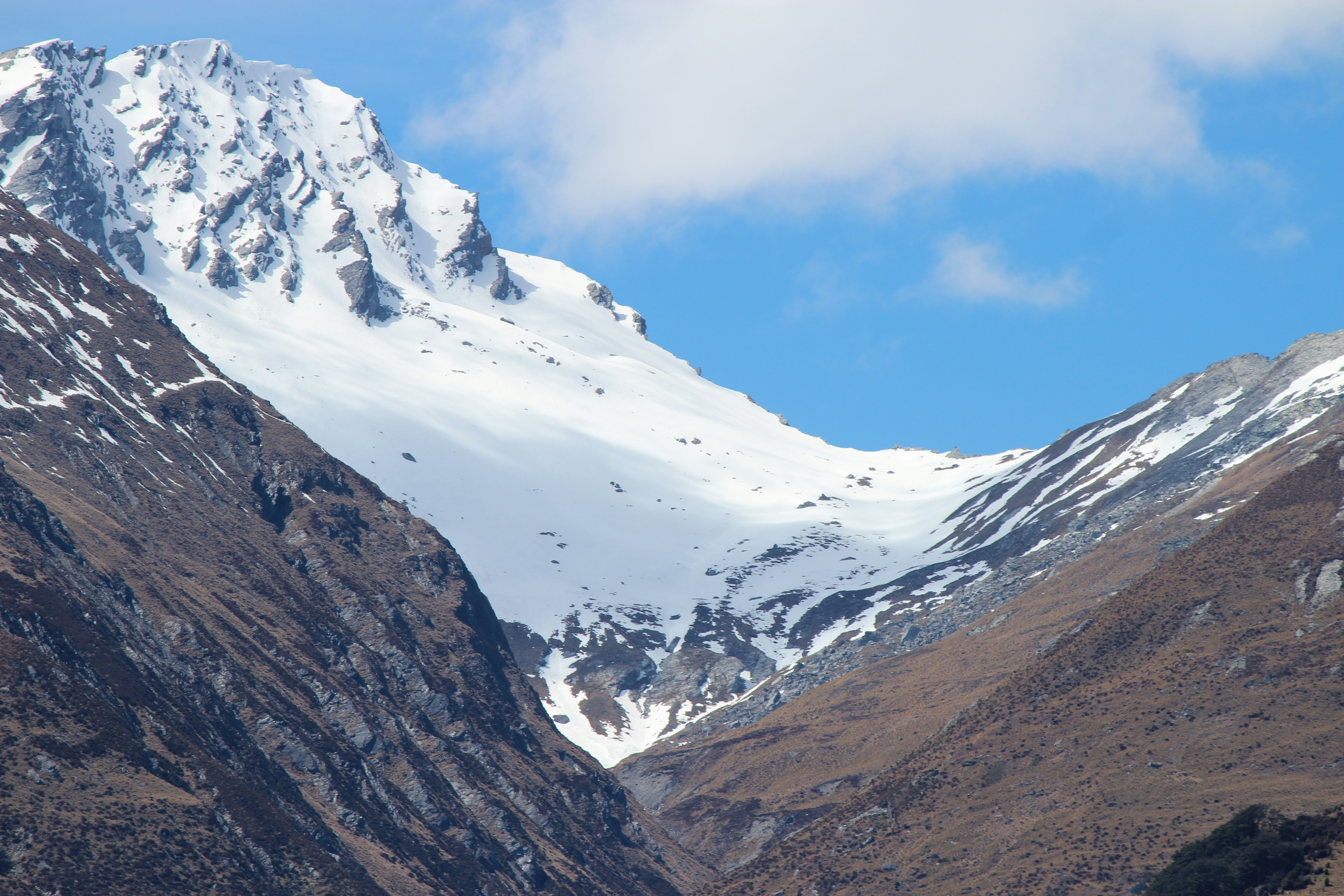 snow covered mountain under blue sky during daytime