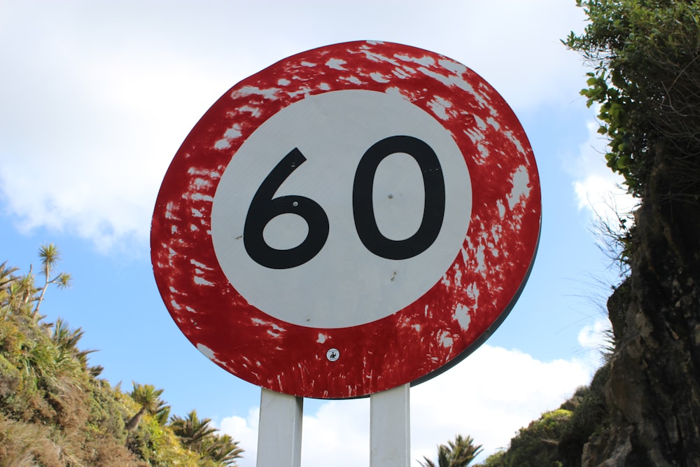 red and white round sign