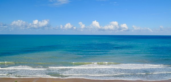 The open Atlantic under white clouds — Pipa, Brazil
