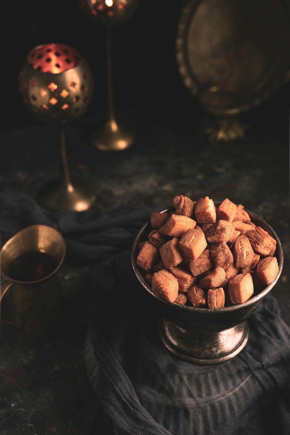 brown and black round food in stainless steel bowl