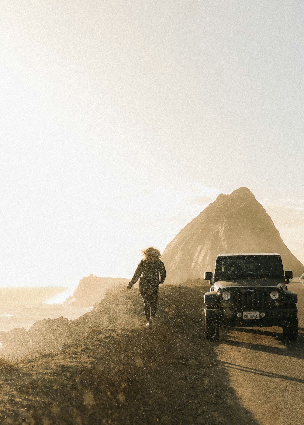 man and woman standing on top of a truck