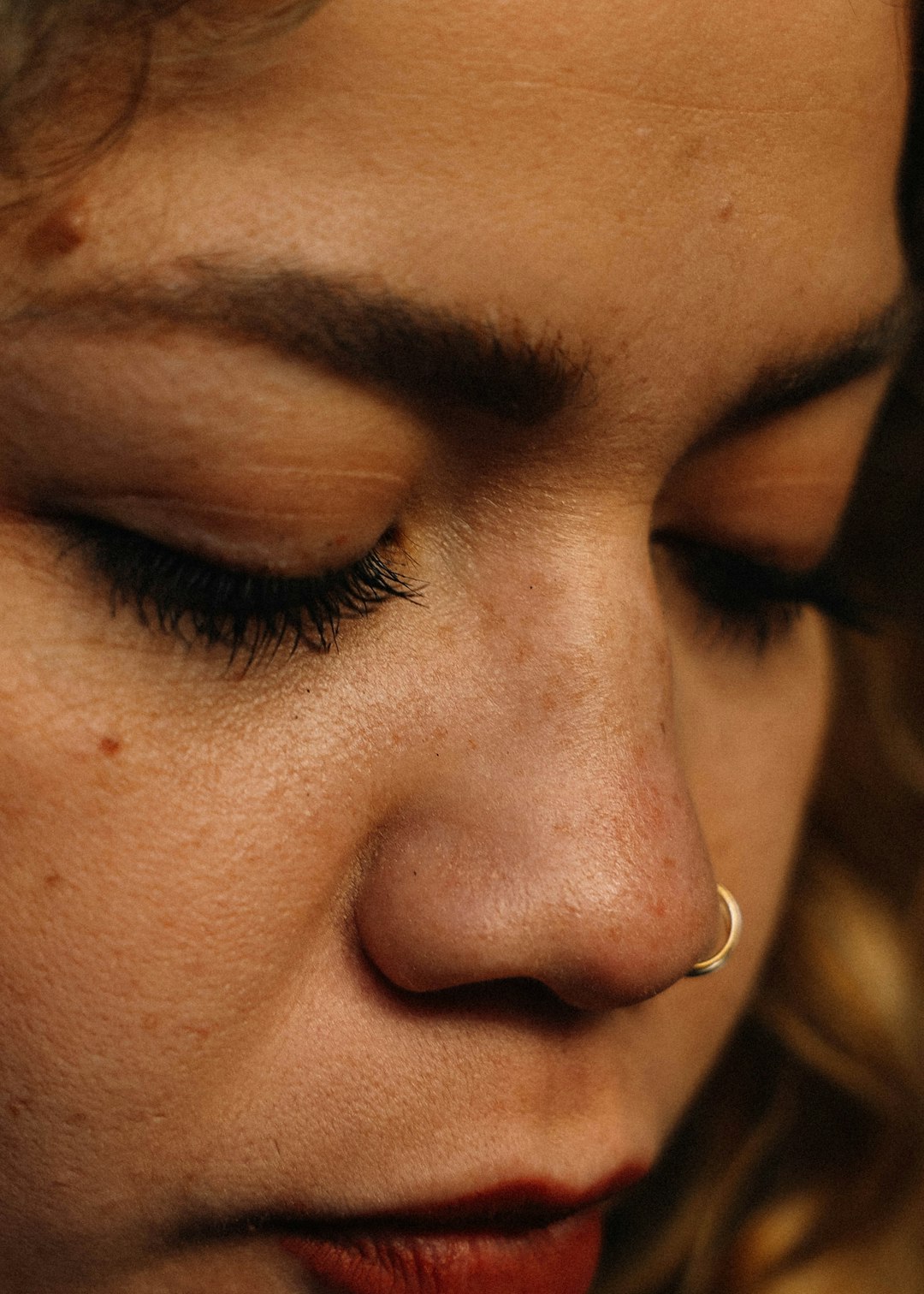 woman with silver nose piercing