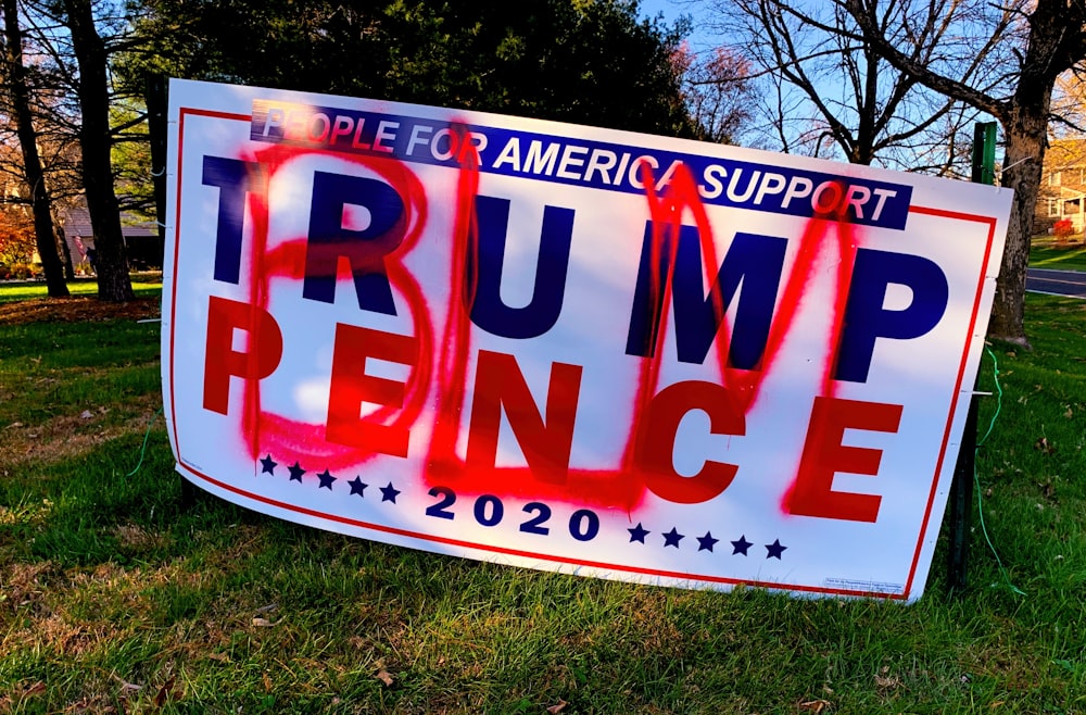 a political sign that is on the grass