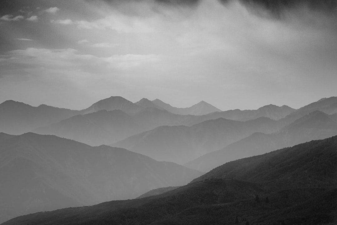 green mountains under white clouds during daytime