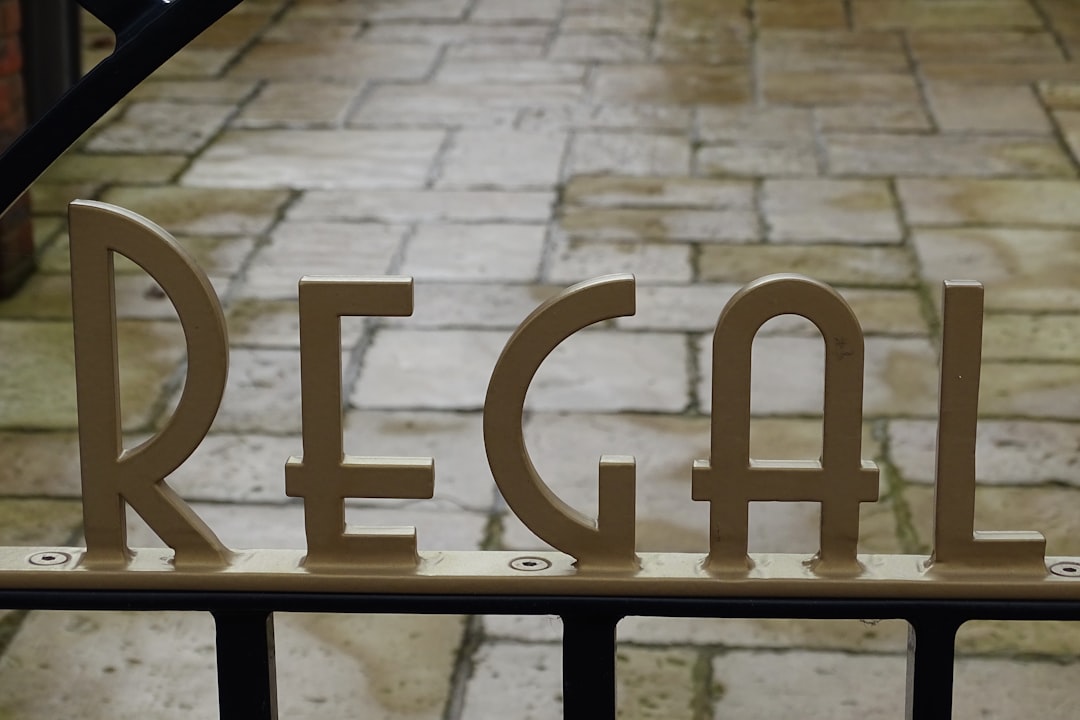 brown wooden love free standing letter, I like the Art Deco sign on the gate of The Regal Cinema in Fordingbridge Hampsh