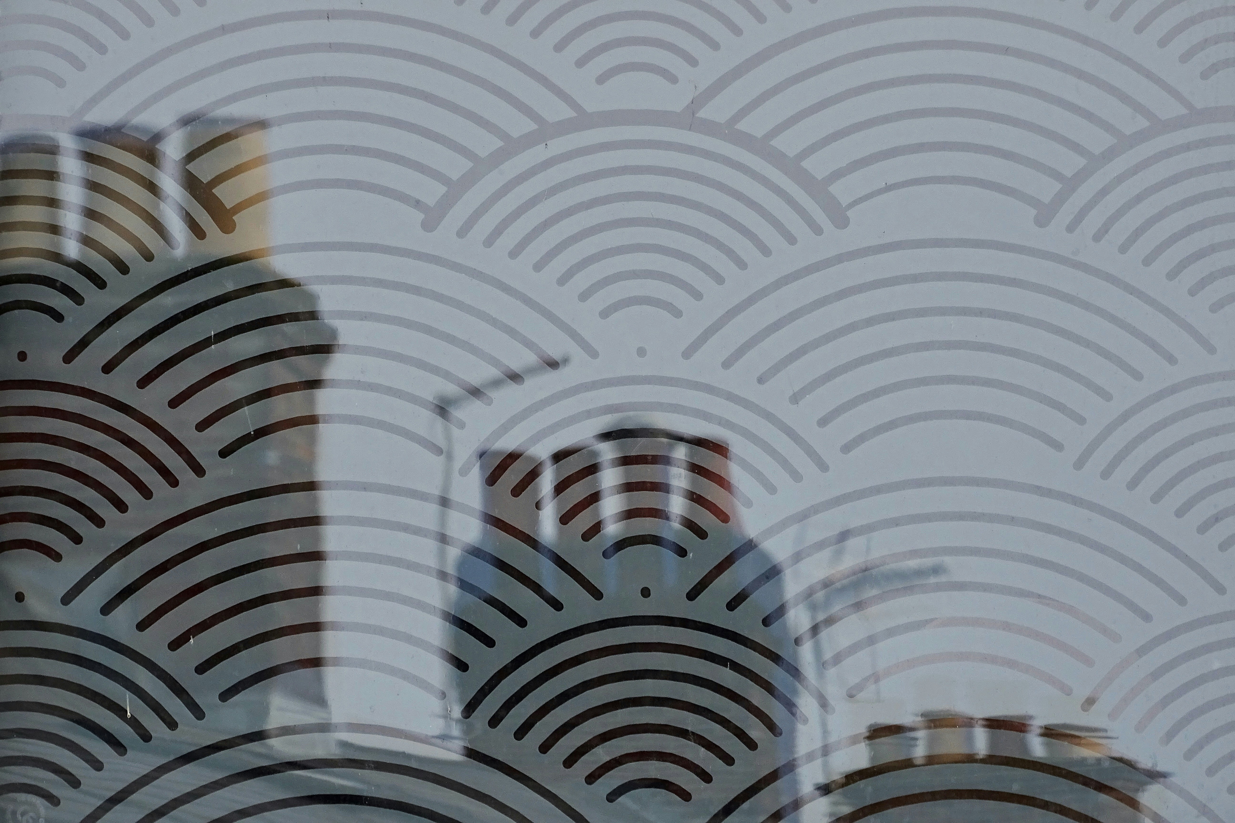 white black and red textile, Chimney Pots reflecting in the Art Deco windows of the Regal Cinema in Fordingbridge Hampshire.  I almost expected to see Chimney Sweeps appear. 