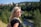 woman in black shirt wearing brown aviator sunglasses