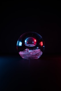 purple and blue ball on black surface