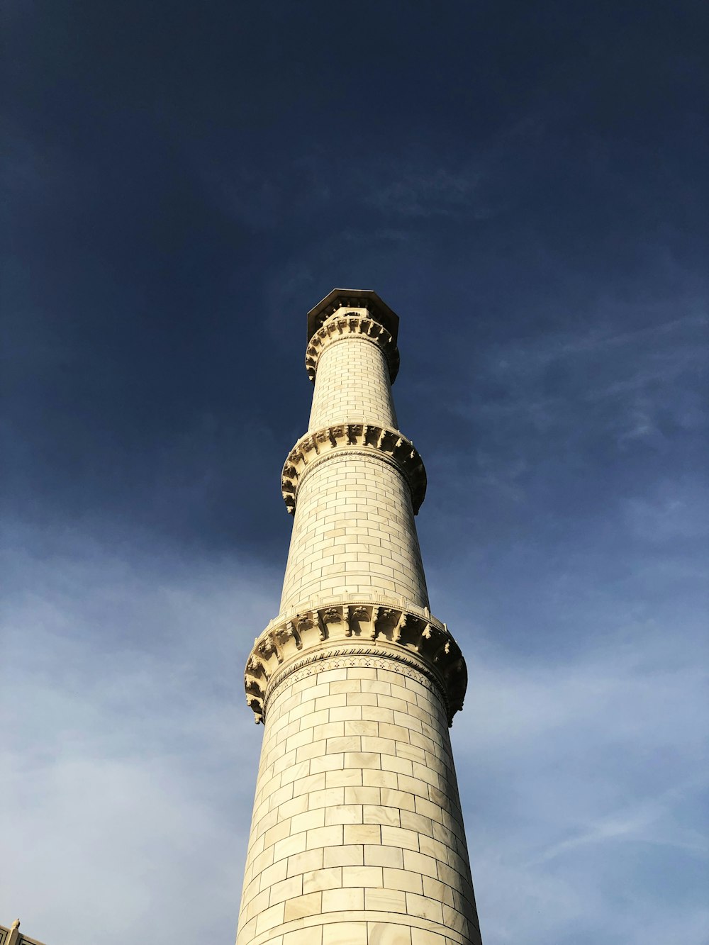 white and brown tower under blue sky