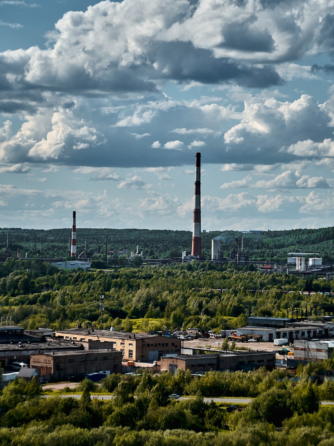 white and black tower under white clouds during daytime