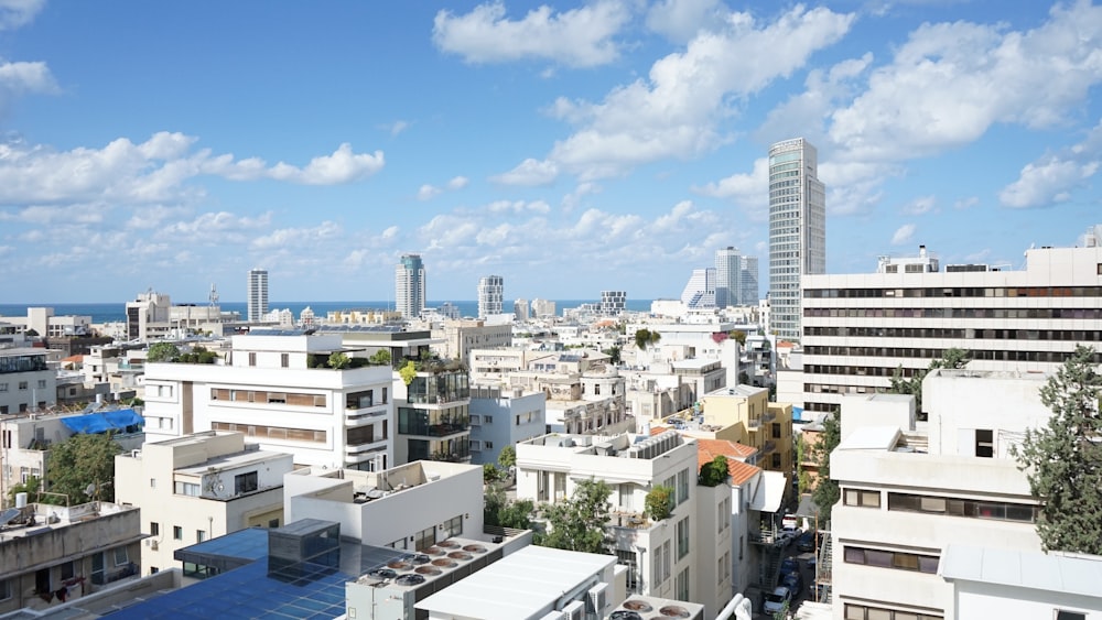 white and gray concrete buildings under blue sky during daytime