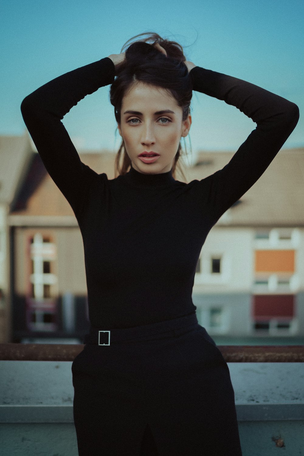 woman in black long sleeve shirt and black skirt