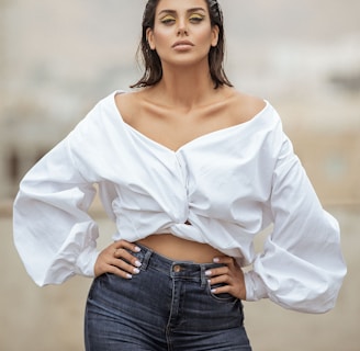 woman in white long sleeve shirt and blue denim jeans