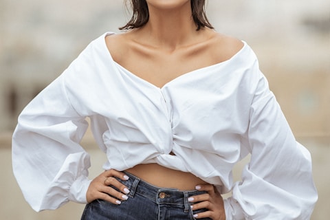 woman in white long sleeve shirt and blue denim jeans