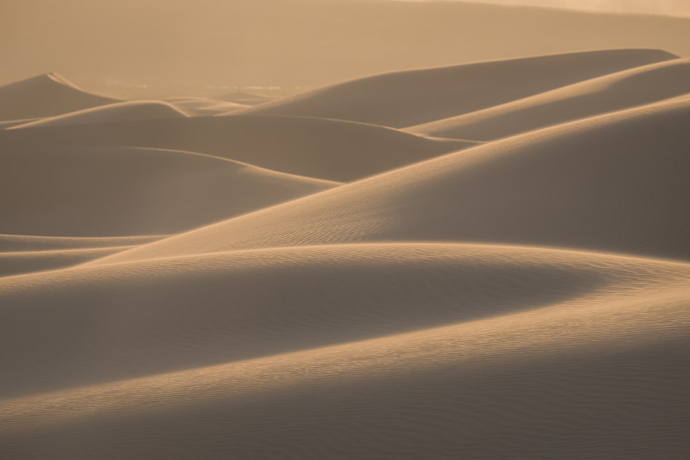 white sand under blue sky during daytime