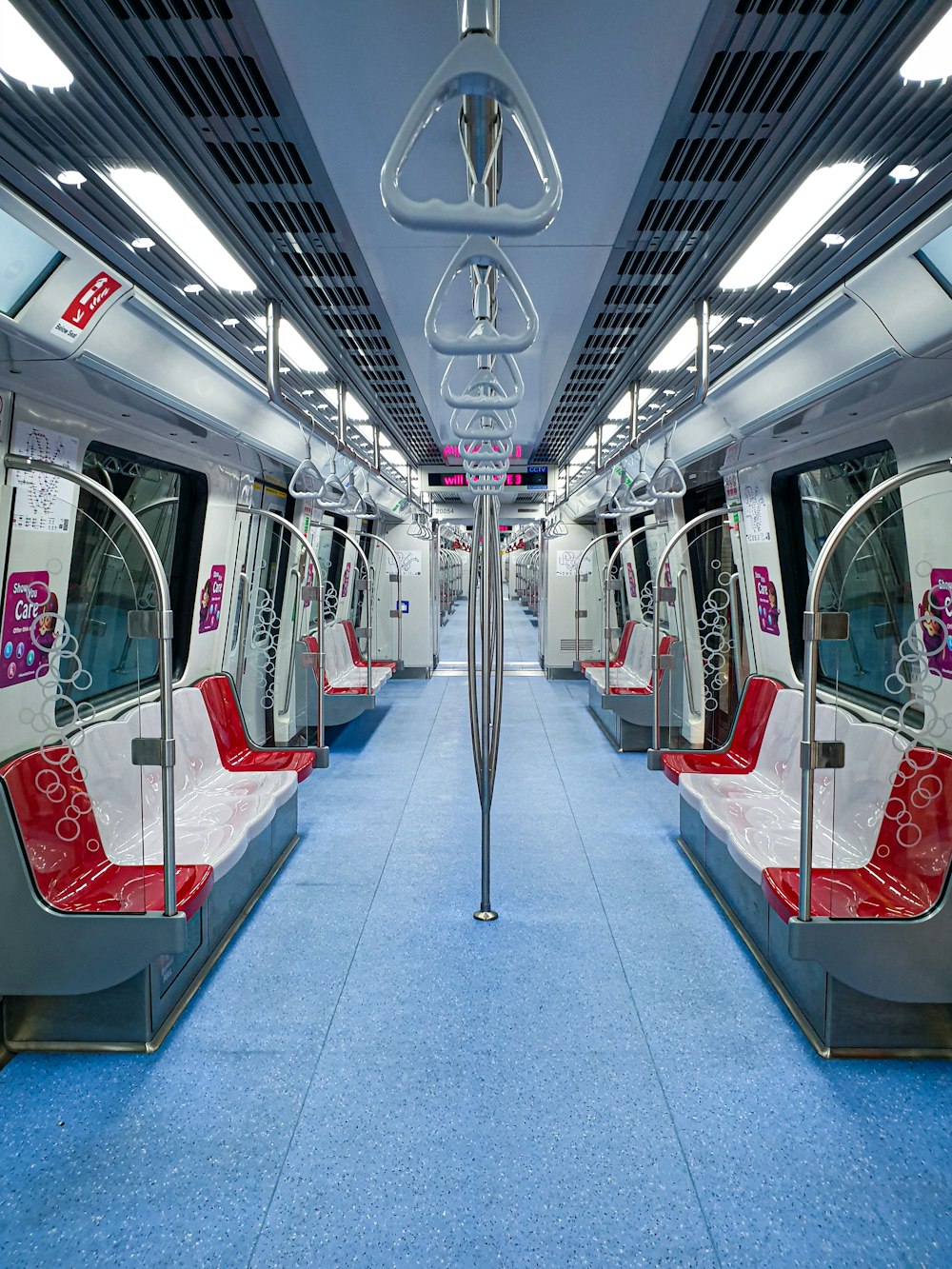 red and white train in train station