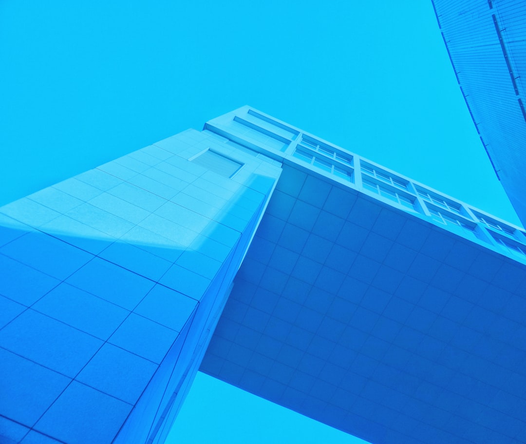 white and blue building under blue sky during daytime
